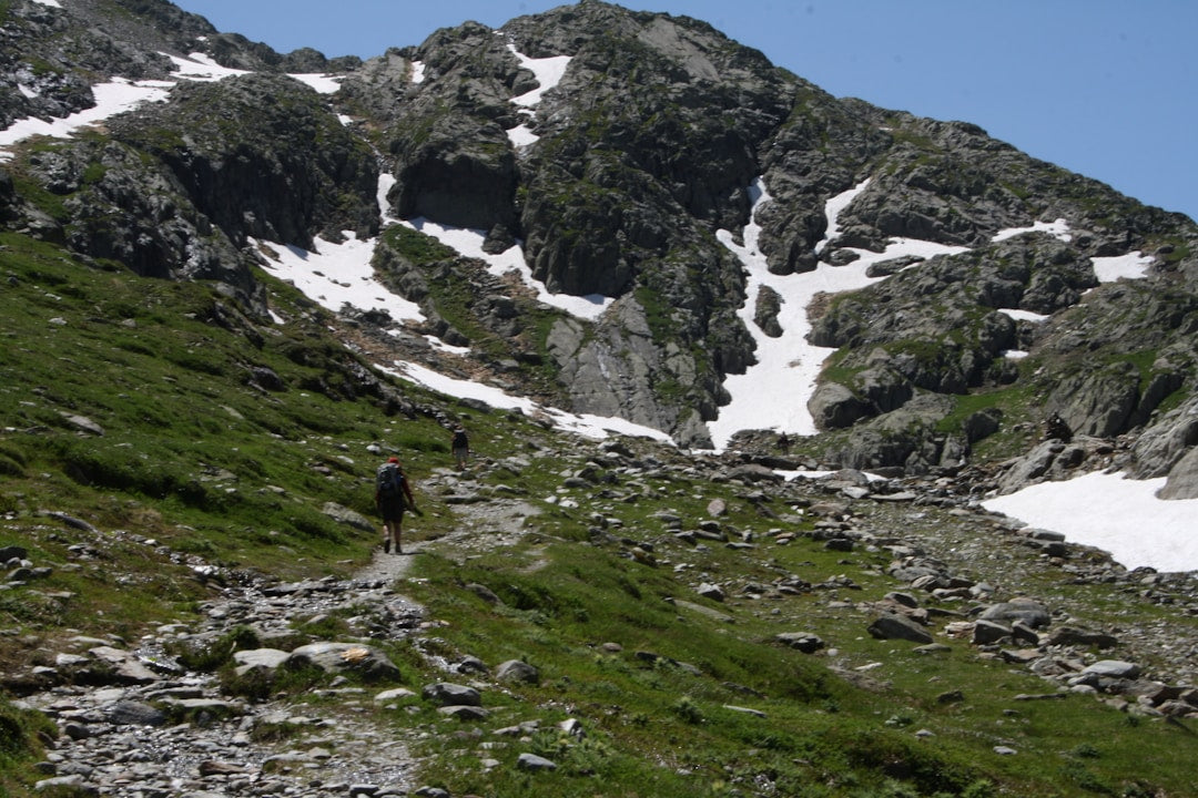 Man hiking in rugged mountain landscape
