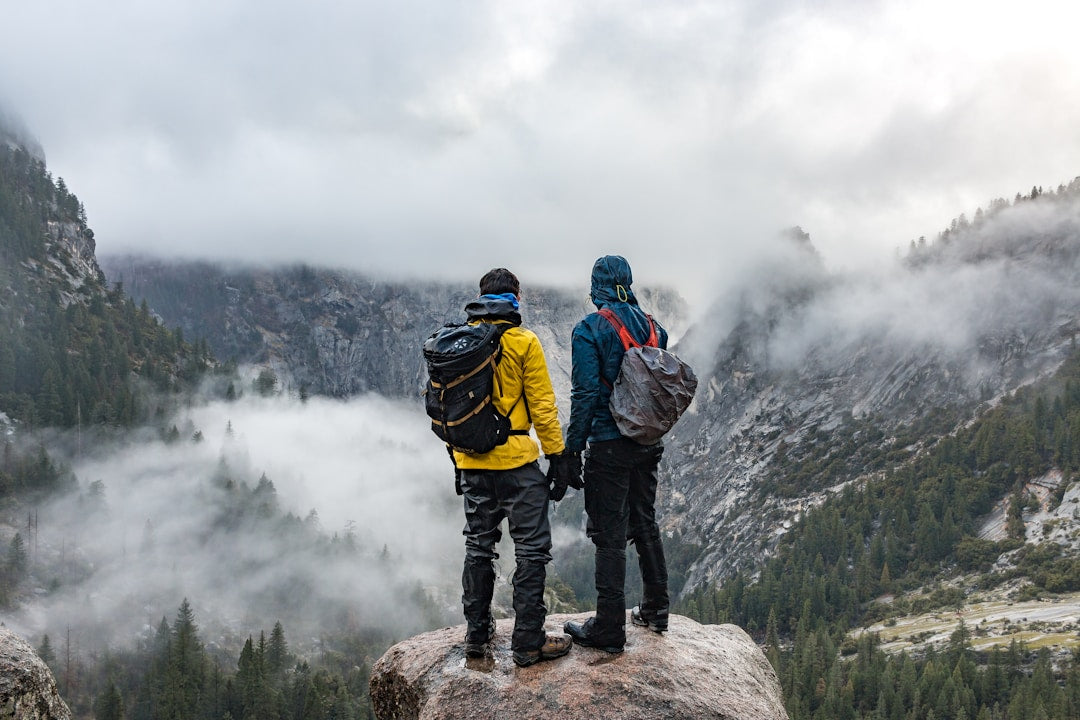 Men hiking and talking - shoulder to shoulder mentorship