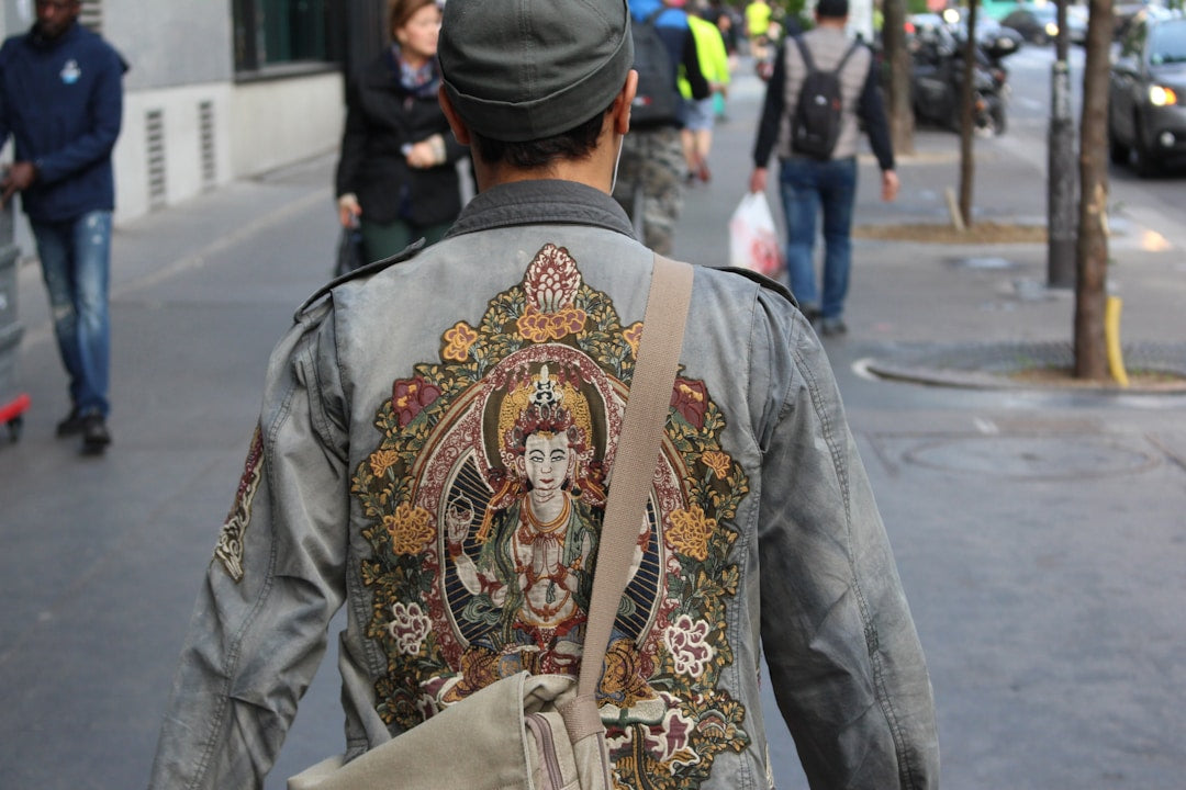 A stylish man confidently wearing modern apparel, representing the fusion of faith and fashion.